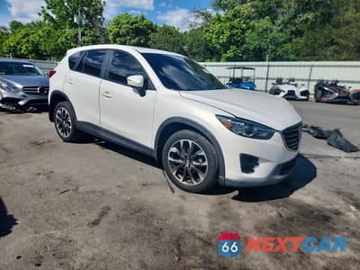 Czwarte zdjęcie samochodu z boku: 2016 MAZDA CX-5 GT VIN:JM3KE4DY1G0611366 - miniatura