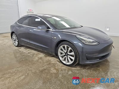 Czwarte zdjęcie samochodu z boku: 2018 TESLA MODEL 3 VIN:5YJ3E1EB3JF185257 - miniatura