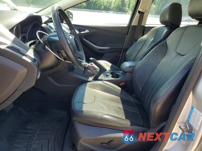 Zdjęcie 7 z 13 samochodu: 2014 FORD FOCUS TITANIUM VIN:1FADP3N20EL294987 - miniatura