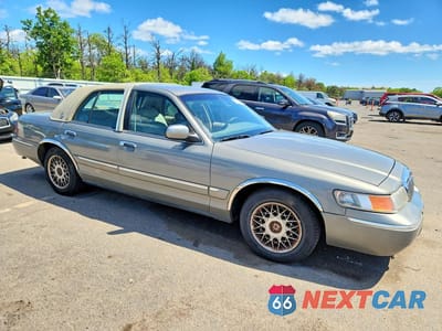 Czwarte zdjęcie samochodu z boku: 2000 MERCURY GRAND MARQUIS VIN:2MEFM74W9YX603014 - miniatura