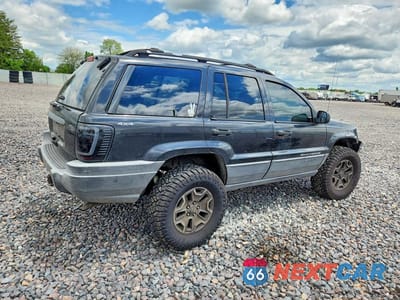 Trzecie zdjęcie samochodu z tyłu: 1999 JEEP GRAND CHEROKEE SPORT VIN:1J4GW58S6XC587386 - miniatura