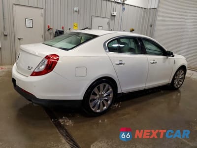 Trzecie zdjęcie samochodu z tyłu: 2013 LINCOLN MKS VIN:1LNHL9FT4DG610301 - miniatura