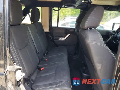 Zdjęcie 10 z 12 samochodu: 2014 JEEP WRANGLER UNLIMITED SAHARA VIN:1C4BJWEGXEL324111 - miniatura