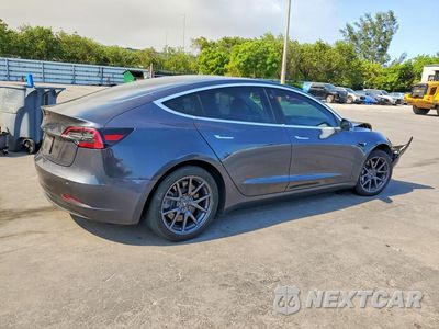 Trzecie zdjęcie samochodu z tyłu: 2019 TESLA MODEL 3 VIN:5YJ3E1EB3KF209588 - miniatura
