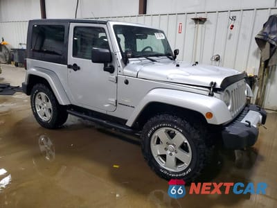 Czwarte zdjęcie samochodu z boku: 2010 JEEP WRANGLER SAHARA VIN:1J4AA5D15AL214901 - miniatura