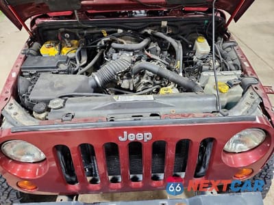 Zdjęcie 12 z 13 samochodu: 2009 JEEP WRANGLER UNLIMITED SAHARA VIN:1J4GA591X9L759460 - miniatura
