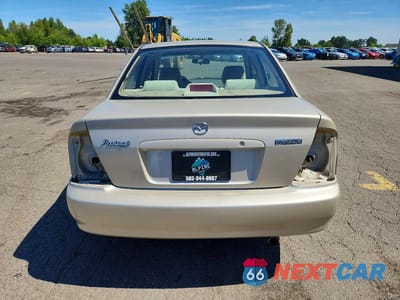 Zdjęcie 6 z 12 samochodu: 2002 MAZDA PROTEGE DX VIN:JM1BJ225420536706 - miniatura