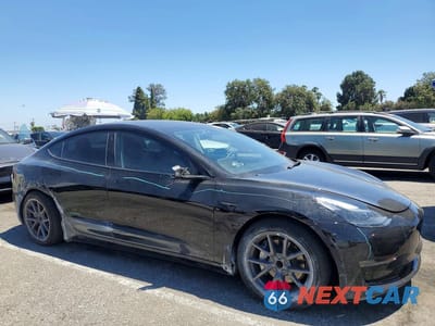 Czwarte zdjęcie samochodu z boku: 2023 TESLA MODEL 3 VIN:5YJ3E1EA4PF432625 - miniatura