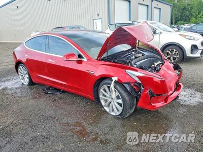 Czwarte zdjęcie samochodu z boku: 2018 TESLA MODEL 3 VIN:5YJ3E1EB2JF135224 - miniatura