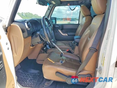 Zdjęcie 7 z 13 samochodu: 2014 JEEP WRANGLER UNLIMITED SAHARA VIN:1C4HJWEG9EL322926 - miniatura