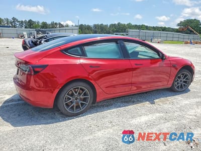 Trzecie zdjęcie samochodu z tyłu: 2023 TESLA MODEL 3 VIN:5YJ3E1EA3PF453899 - miniatura