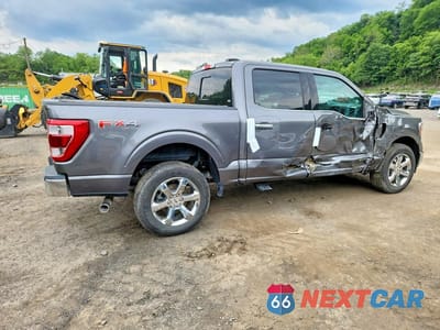Trzecie zdjęcie samochodu z tyłu: 2023 FORD F150 4WD LARIAT CREW 3.5 HYBRID VIN:1FTFW1ED3PFC46302 - miniatura
