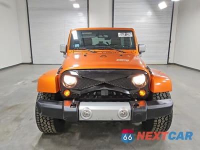Piąte zdjęcie samochodu w środku: 2011 JEEP WRANGLER UNLIMITED SAHARA VIN:1J4HA5H11BL542536 - miniatura
