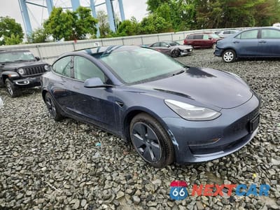 Czwarte zdjęcie samochodu z boku: 2023 TESLA MODEL 3 VIN:5YJ3E1EA0PF405924 - miniatura