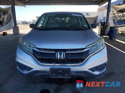 Piąte zdjęcie samochodu w środku: 2015 HONDA CR-V LX VIN:2HKRM3H34FH504221 - miniatura