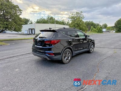 Czwarte zdjęcie samochodu z boku: 2017 HYUNDAI SANTA FE SPORT 2.4L VIN:5XYZUDLB4HG408541 - miniatura