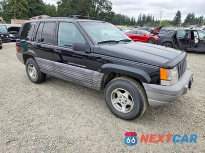 Czwarte zdjęcie samochodu z boku: 1998 JEEP GRAND CHEROKEE LAREDO VIN:1J4GZ58SXWC372695 - miniatura