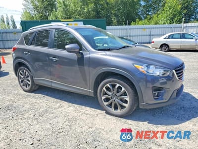 Czwarte zdjęcie samochodu z boku: 2016 MAZDA CX-5 GT VIN:JM3KE4DY6G0900033 - miniatura
