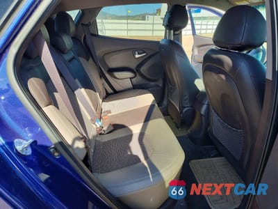 Zdjęcie 10 z 12 samochodu: 2013 HYUNDAI TUCSON GLS VIN:KM8JUCAC6DU629369 - miniatura