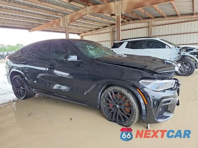 Czwarte zdjęcie samochodu z boku: 2022 BMW X6 M50I VIN:5UXCY8C03N9K75041 - miniatura