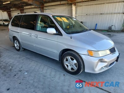 Czwarte zdjęcie samochodu z boku: 2001 HONDA ODYSSEY VIN:2HKRL18741H563255 - miniatura