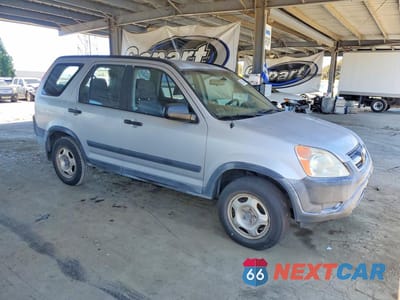 Czwarte zdjęcie samochodu z boku: 2002 HONDA CR-V LX VIN:JHLRD68412C016721 - miniatura