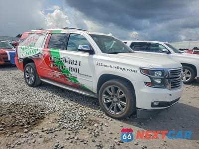 Czwarte zdjęcie samochodu z boku: 2015 CHEVROLET SUBURBAN C1500 LTZ VIN:1GNSCKKC6FR681828 - miniatura