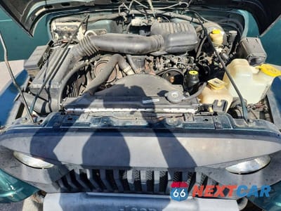 Zdjęcie 12 z 13 samochodu: 1999 JEEP WRANGLER / TJ SE VIN:1J4FY29P4XP460448 - miniatura