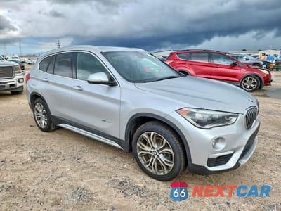 Czwarte zdjęcie samochodu z boku: 2017 BMW X1 XDRIVE28I VIN:WBXHT3Z34H4A57871 - miniatura