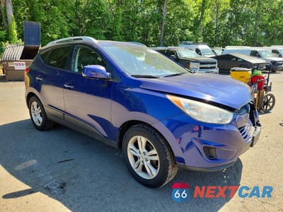 Czwarte zdjęcie samochodu z boku: 2011 HYUNDAI TUCSON GLS VIN:KM8JU3AC2BU134714 - miniatura