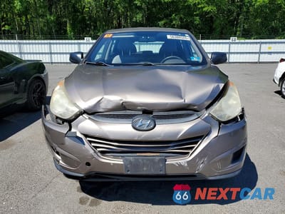 Piąte zdjęcie samochodu w środku: 2010 HYUNDAI TUCSON GLS VIN:KM8JT3AC3AU076498 - miniatura