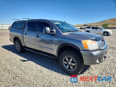 Czwarte zdjęcie samochodu z boku: 2015 NISSAN TITAN PRO-4X VIN:1N6BA0EC9FN510090 - miniatura