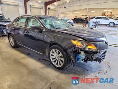 Czwarte zdjęcie samochodu z boku: 2015 LINCOLN MKS VIN:1LNHL9EK0FG601199 - miniatura