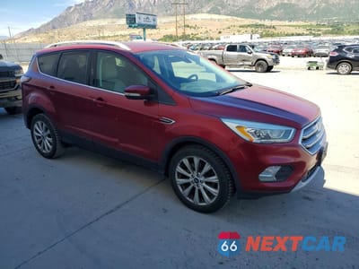 Czwarte zdjęcie samochodu z boku: 2017 FORD ESCAPE TITANIUM VIN:1FMCU0J97HUB83279 - miniatura