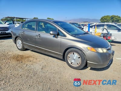 Czwarte zdjęcie samochodu z boku: 2006 HONDA CIVIC HYBRID VIN:JHMFA36266S004020 - miniatura