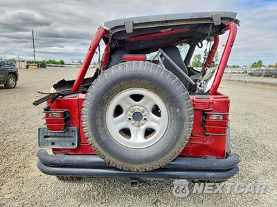 Zdjęcie 6 z 13 samochodu: 1999 JEEP WRANGLER SPORT VIN:1J4FY19S3XP482830 - miniatura
