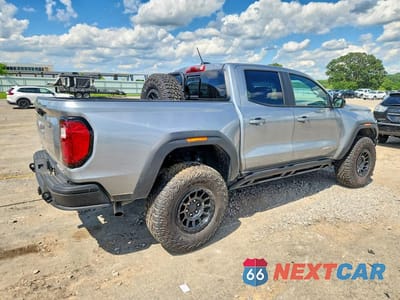 Trzecie zdjęcie samochodu z tyłu: 2024 GMC CANYON AT4X VIN:1GTP6EEK7R1205259 - miniatura