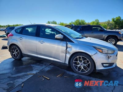 Czwarte zdjęcie samochodu z boku: 2018 FORD FOCUS SEL VIN:1FADP3M21JL211708 - miniatura