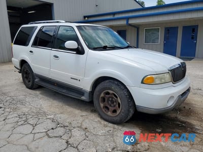 Czwarte zdjęcie samochodu z boku: 2001 LINCOLN NAVIGATOR VIN:5LMFU28R21LJ20243 - miniatura