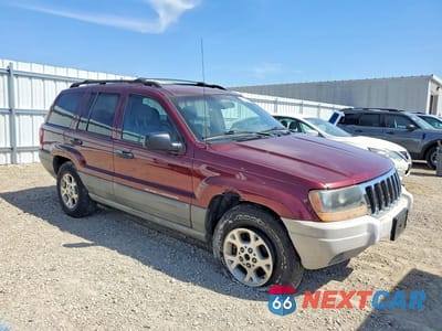 Czwarte zdjęcie samochodu z boku: 2000 JEEP GRAND CHEROKEE LAREDO VIN:1J4GW48S2YC308821 - miniatura
