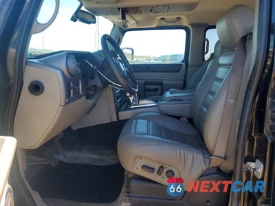 Zdjęcie 7 z 13 samochodu: 2004 HUMMER H2 VIN:5GRGN23UX4H103393 - miniatura