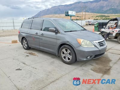 Czwarte zdjęcie samochodu z boku: 2010 HONDA ODYSSEY TOURING VIN:5FNRL3H95AB018905 - miniatura