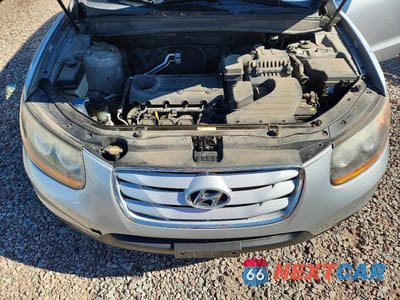 Zdjęcie 12 z 13 samochodu: 2010 HYUNDAI SANTA FE GLS VIN:5NMSG3AB6AH414438 - miniatura