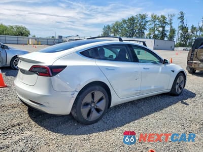 Trzecie zdjęcie samochodu z tyłu: 2018 TESLA MODEL 3 VIN:5YJ3E1EA2JF161779 - miniatura