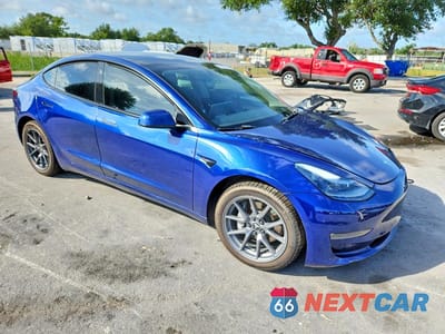 Czwarte zdjęcie samochodu z boku: 2022 TESLA MODEL 3 VIN:5YJ3E1EB8NF198785 - miniatura