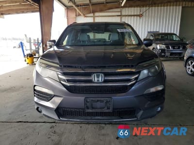 Piąte zdjęcie samochodu w środku: 2016 HONDA PILOT TOURING VIN:5FNYF5H94GB016036 - miniatura