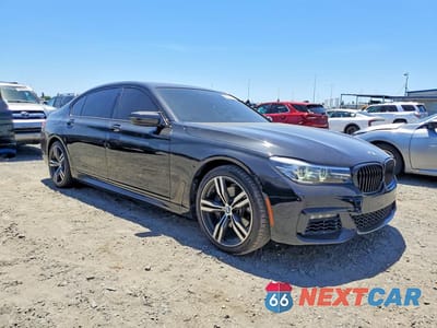 Czwarte zdjęcie samochodu z boku: 2016 BMW 740 I VIN:WBA7E2C58GG547440 - miniatura