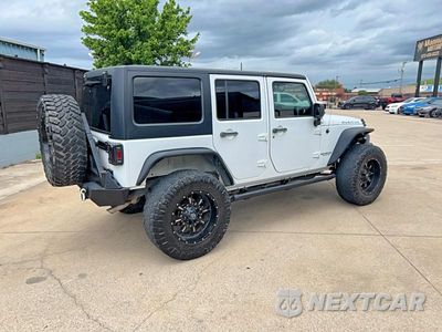Czwarte zdjęcie samochodu z boku: 2015 JEEP WRANGLER UNLIMITED RUBICON VIN:1C4BJWFG3FL530855 - miniatura