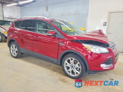 Czwarte zdjęcie samochodu z boku: 2016 FORD ESCAPE TITANIUM VIN:1FMCU9J98GUB67563 - miniatura