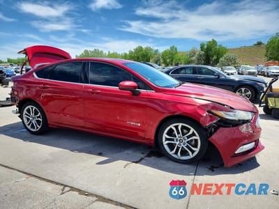 Czwarte zdjęcie samochodu z boku: 2017 FORD FUSION SE HYBRID VIN:3FA6P0LU3HR278400 - miniatura